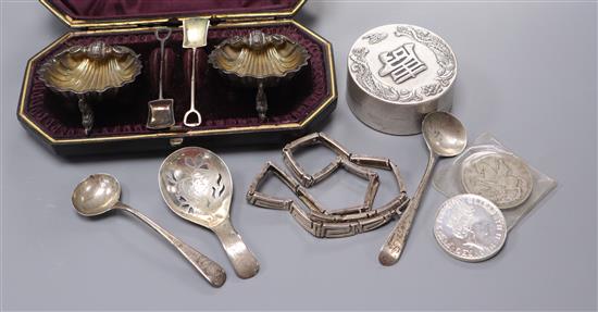 A cased pair of Victorian silver shell shaped salts and other items including a George III silver caddy spoon.